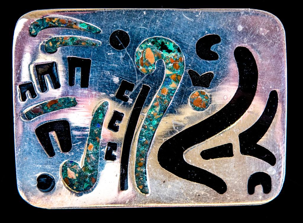 Taxco Sterling Inlaid Modernist Pin -Mexico: Item/Description: Modernist, signed Sterling Silver pin with inlaid turquoise and onyx. Unique construction: onyx slice is sandwiched between two pieces of silver. Linear decorations resembles primiti