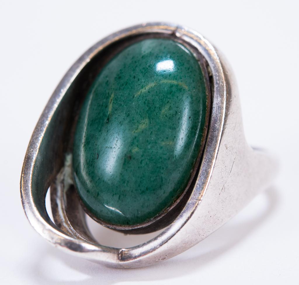 Erika Hult de Corral Chrysoprase Sterling Ring: Item/Description: Modernist, designer Taxco ring has a fluid, free-form, solid Sterling Silver mounting with a recessed, oval deep green Chrysoprase. Wonderful natural variations. Studio art piece des