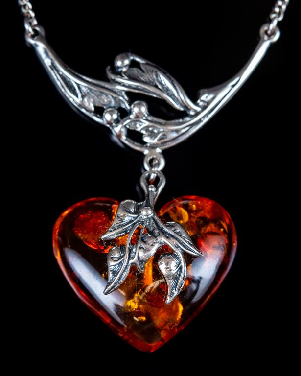 Russian Sterling & Amber Heart Pendant Necklace: Item/Description: Lovely, unworn Russian Sterling Silver and Amber necklace. Art Nouveau design with stylized leaf and berry bale and accents. Heart shaped amber charm is golden, apple juice color wit