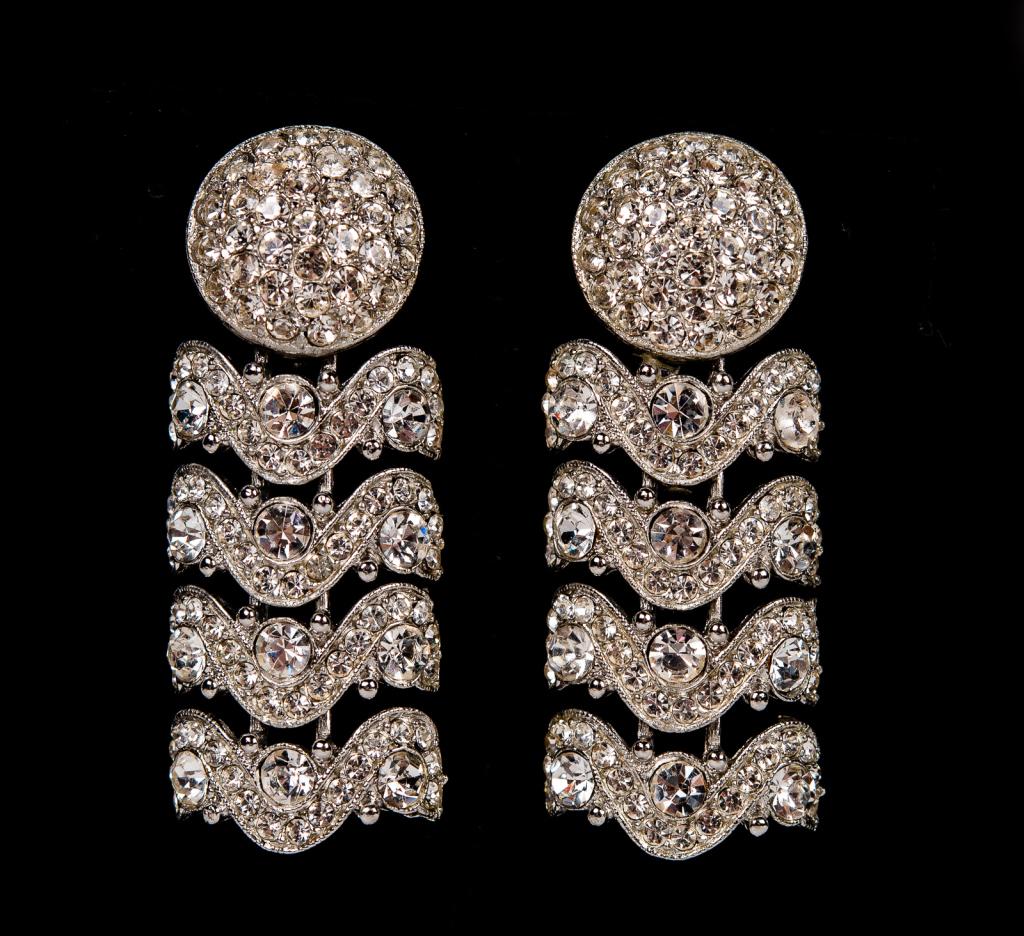 Deco Style Rhinestone Dangle Drop Earrings: Item/Description: Unique, Art Deco style sparkly cascading drop earrings. Domed clips encrusted with pave rhinestones suspend four articulated jeweled "wave" panels of varying sized rhinestones. Rhodi