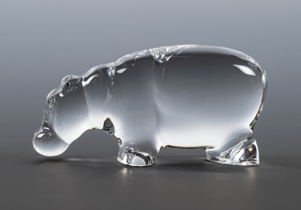 Baccarat Crystal Hippopotamus: Item/Description: Clear glass hippo by Baccarat. Maker marks and signed on bottom. Material: Glass. Dimensions: Height: 1 1/2"; Width: 3". Condition: Minor surface wear. No noticeable chips or cracks.