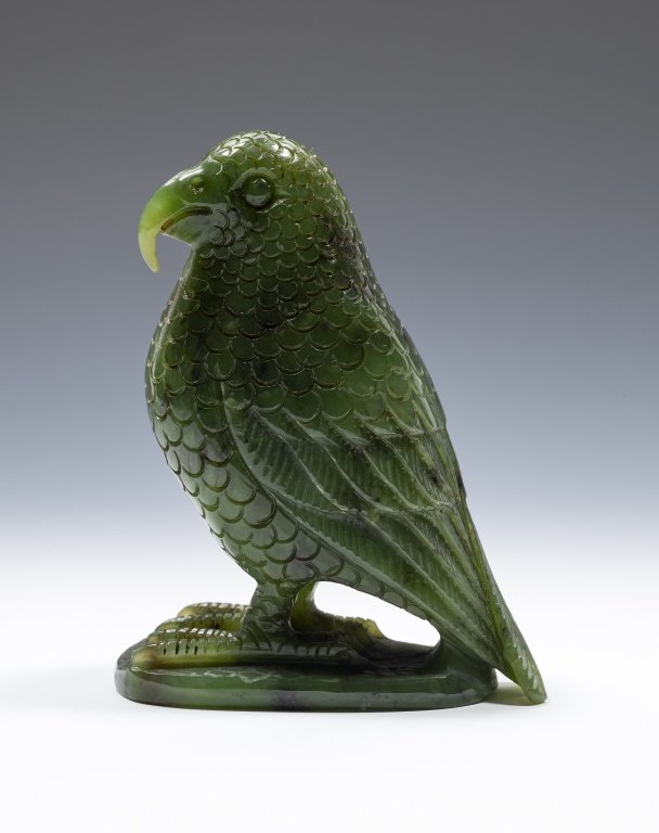 Carved Jade Stone Glass Parrot, New Zealand: Item/Description: Nephrite jade green carved stone bird. Signed and dated on bottom. Also marked with NZ. Material: Stone. Dimensions: Height: 3 3/4"; Width: 3". Condition: Minor surface wear. No noti