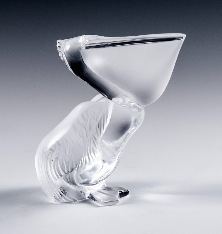 Daum France Crystal Pelican: Item/Description: Frosted and clear art glass sculpture of a pelican. Signed Daum France to bottom. Includes original Daum box as shown. Material: Glass. Dimensions: Height: 4"; Width: 2 3/4". Conditi