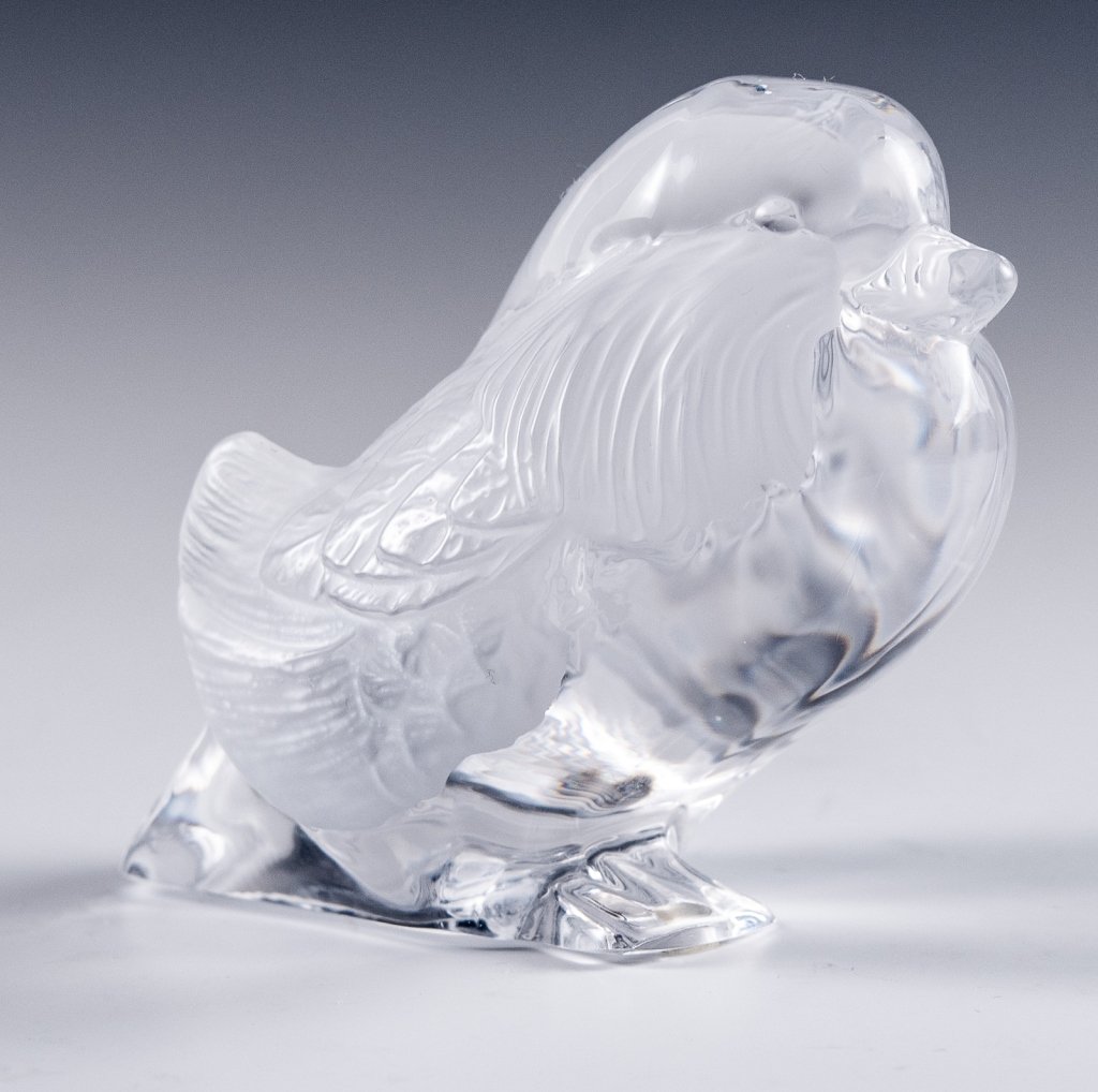 Daum France Crystal Bird Figurine: Item/Description: Signed art glass bird. Features sitting bird with feather detail. Bottom marked Daum France. Includes original Daum box as shown. Material: Glass. Dimensions: Height: 2 3/4"; Width: 