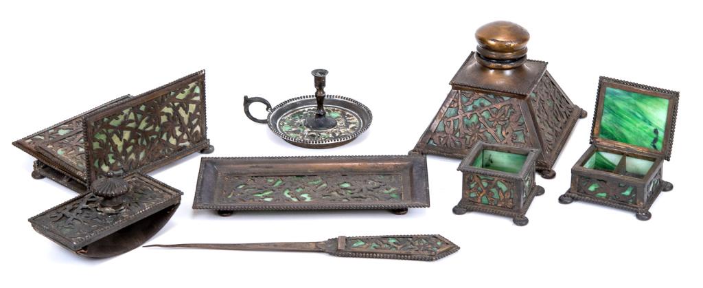 Apollo New York Art Nouveau 8 Piece Desk Set: Item/Description: Arts & Crafts era desk set made by 'APOLLO STUDIOS, NEW YORK.' All with green slag glass. Eight piece set includes: tray, letter opener, candle stick, ink well, covered stamp box, bl