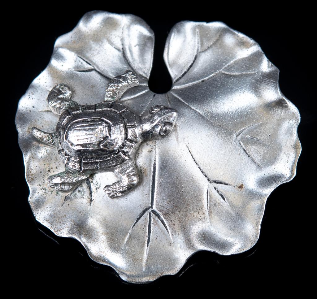 M.B. Sterling Turtle on Lily Pad Brooch: Item/Description: Charming figural pin fashioned from Sterling Silver has a turtle resting on a lilypad. Matte surface, Nouveau-esque and beautifully made. Roll-over clasp. Hallmarked on back: M.B. St
