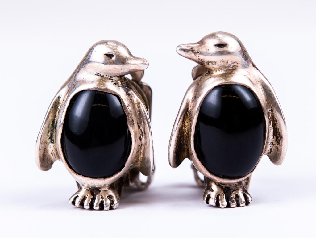 Sterling & Onyx Penguin Clip Earrings: Item/Description: Charming figural penguin clip-on earrings fashioned from Sterling Silver and polished black Onyx. Standing at attention and looking at one another. Unmarked, tested as Sterling. Mate