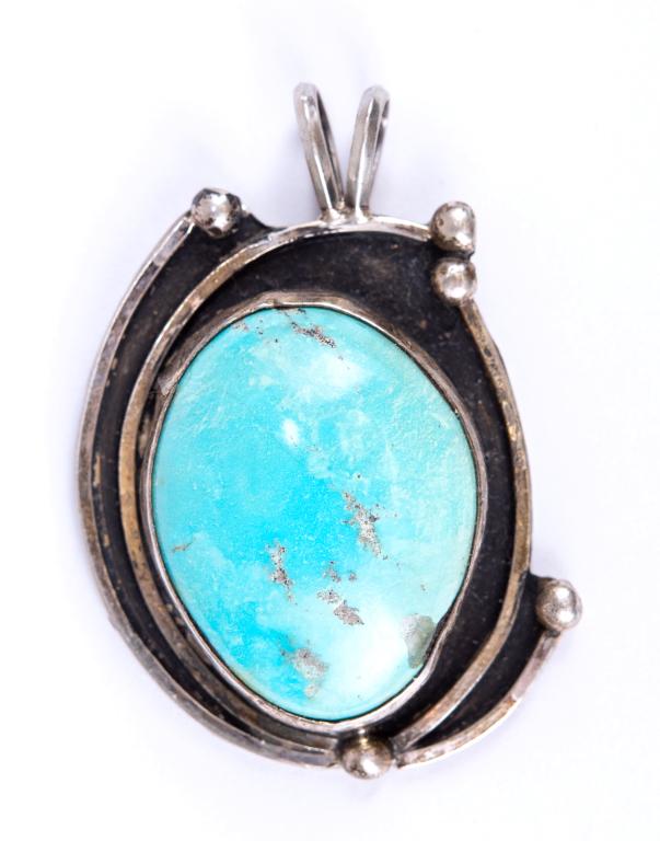 Native American Sterling & Turquoise Pendant: Item/Description: Modernist pendant in Sterling Silver has curved segments accented with balls, oxidized background and center, bezel set azure blue turquoise cabochon. Doubled hanging loop. No discer