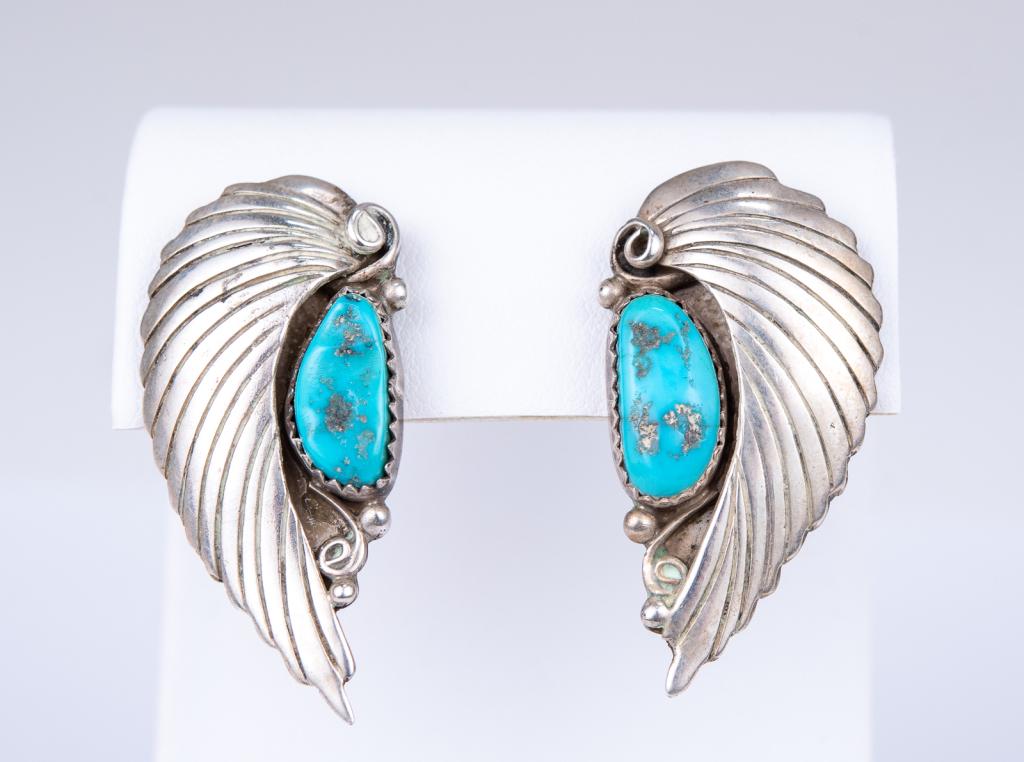 Native American Sterling Turquoise Earrings: Item/Description: Native American Sterling Silver pierced earrings fashioned as stylized curved feathers; bead accents; set with azure blue turquoise stones in saw tooth mountings. Straight posts. Unm