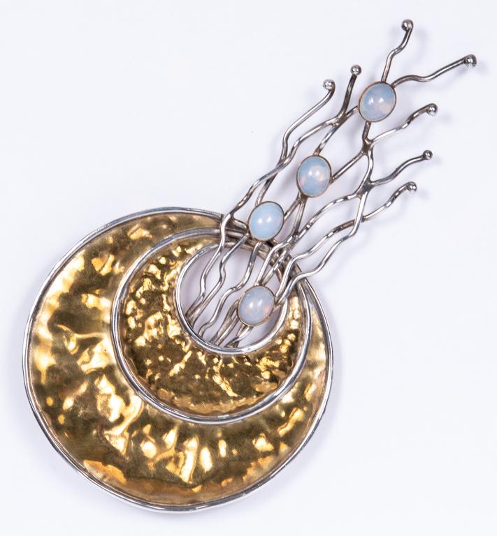 Silver & Brass Moonstone Jellyfish Pin Pendant: Item/Description: Unique, figural jellyfish pin pendant. Handwrought, wearable art. Fluid and dynamic this aquatic themed piece is fashioned from hand-hammered crescent shaped slices of brass. Floatin