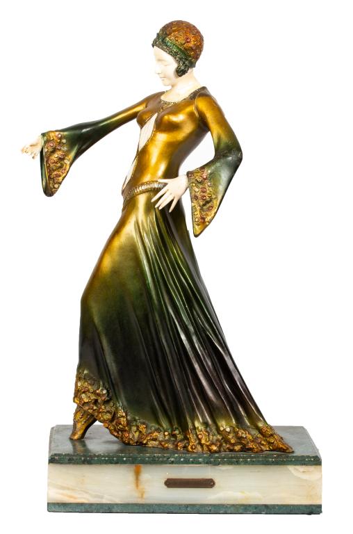 Dimitri Chiparus Art Deco Dancer Bronze: Item/Description: Cold painted bronze sculpture of a dancer after Dimitri Chiparus. Carved hands, face and cut out panels to dress. Marble and onyx base has mounted plaque engraved: D.H. Chiprus. Stam