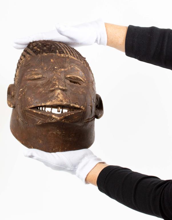 Makonde Mozambique Style Helmet Mask: Item/Description: Decorative Makonde helmet mask. Lipiko masks, which in the language of the Makonde people means “helmet mask" come from the minority ethnic group of the Makonde live in southern Ta