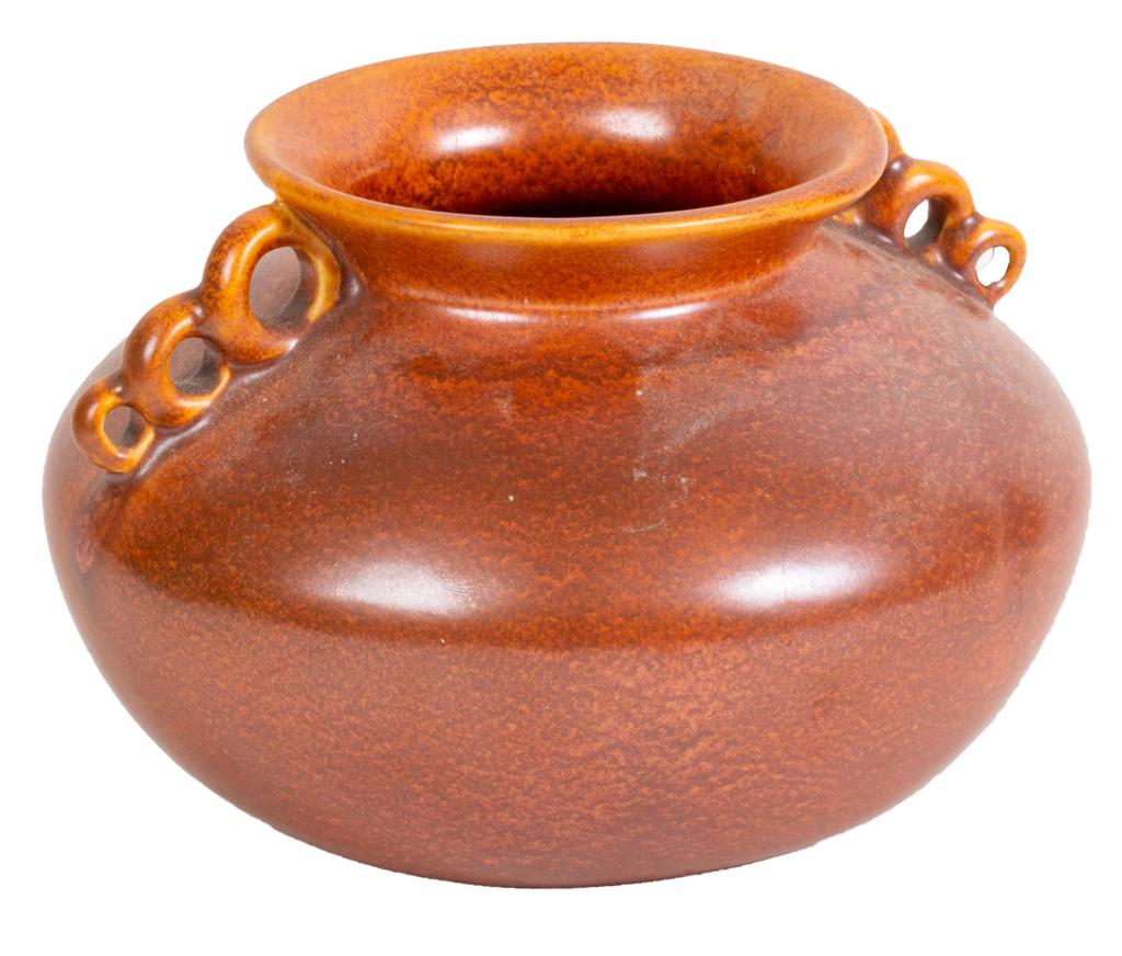Barbara Garrison Glazed Art Pottery Vase: Item/Description: Brown glazed vase with triple hole handle detail. Barbara Garrison label, loose but included. Material: Ceramic Dimensions: Diameter: 7"; Height: 4 3/4" Condition: Minor surface wear