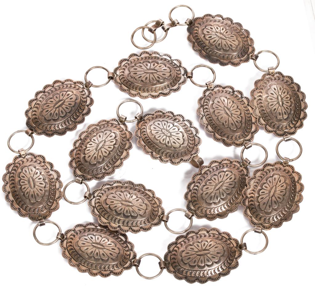 Native American Sterling Silver Concho Belt: Item/Description: Exquisite Native American Southwestern Concho belt fashioned from Sterling Silver. Traditional artisan workmanship and design, scalloped edges, finely engraved. Hallmarked: Sterling 