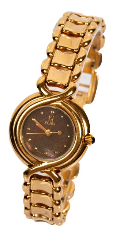 Fendi Goldtone Abalone Quartz Watch in Box: Item/Description: Sleek Fendi gold tone ladies quartz watch. Abalone face, gold dot hour markers. Cabochon sapphire jewel tipped crown. Attractive link band with scalloped edges. Fold-over clasp, doub