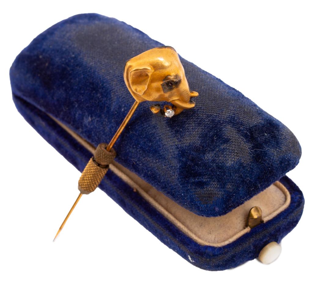 Antique Victorian Gold Elephant Stickpin: Item/Description: Fantastic Victorian era stickpin jabot fashioned as an elephant head. Lustrous low karat gold, soft finish. Finely casted elephant head with tusks and jeweled ruby and diamond accent