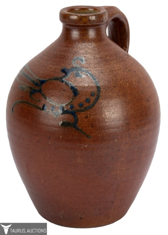 Salt Glaze Handled Pottery Jug w Blue Bird: Item/Description: Caramel colored salt glaze handled jug with abstract bird. Oval incised stamp maker's mark. (Earthenware Wine Jug, Terracotta Water Jug, American Blue Decorated Stoneware)Material: P