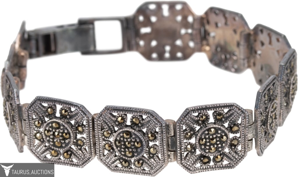 Sterling & Marcasite Deco Style Line Bracelet: Item/Description: Art Deco style geometric panel bracelet. Crafted from Sterling Silver and comprised of ornate pierce work octagonal links encrusted with hand-set sparkly marcasites. Hidden links. Be