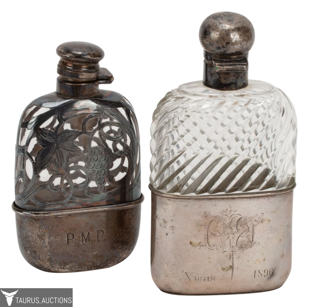 Pair of Silver and Glass Gentleman's Flasks: Item/Description: Two Victorian hip flasks. Includes: PMP Sterling Bottle: Base hallmarked Sterling 202. Hinged top flask. Cork inside lid. Sterling overlay over glass. Pierce work grapes and vines. B