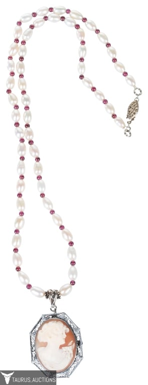Pearl Strand with Cameo Pendant Necklace: Item/Description: Unique studio artisan pearl necklace with cameo pendant. The strand is comprised of lustrous ovoid shaped freshwater pearls alternating with polished wine colored round garnets beads