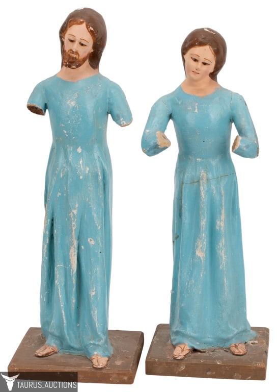 Pair of Santos Figures with Glass Eyes: Item/Description: Polychromed carved wood Santos figures, one male and one female, likely intended to represent Mary and Joseph, Both with glass eyes. Each is mounted on wood base. (Saint, Religious F