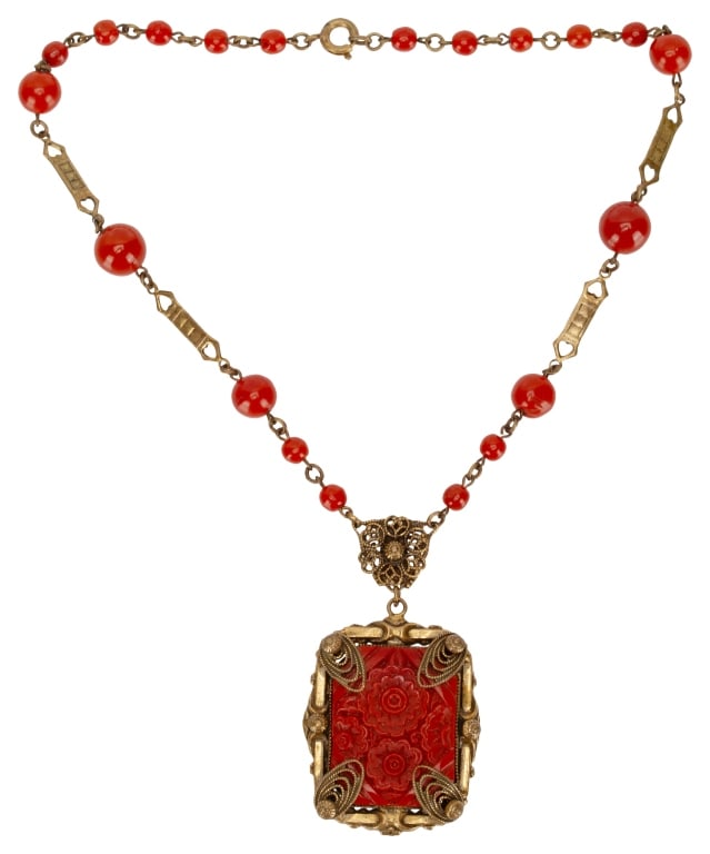 Art Deco Czech Carved Glass Pendant Necklace: Item/Description: Art Deco Egyptian Revival coral glass bead and gilt brass pendant necklace. Exquisite workmanship and attention to detail. Deep orange red glass beads resemble coral. Alternating sta