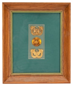 Three Framed WWII US Army Cap Badges
