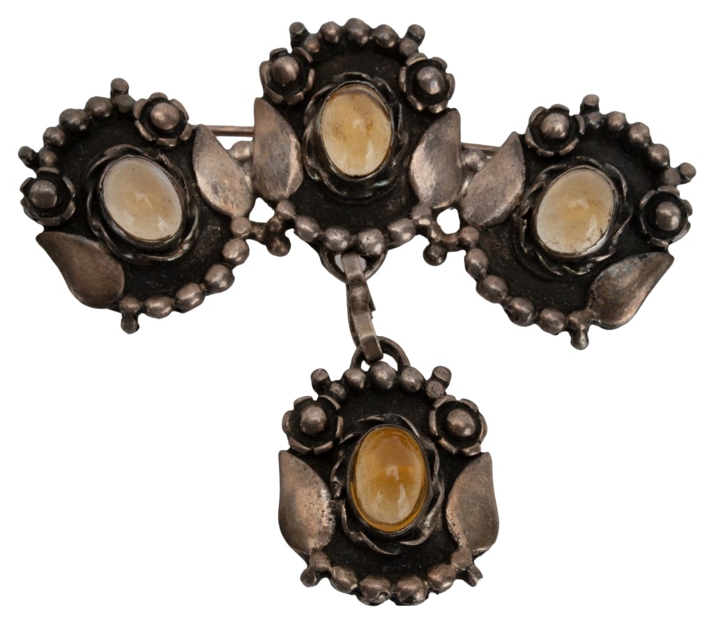 Art Nouveau Sterling Citrine Glass Cabochon Brooch: Item/Description: Exceptional Arts and Crafts Art Nouveau era brooch hand-crafted from silver and bezel set with luminous cabochon citrine glass stones. Curved shape pin. Floral motif with applied flo