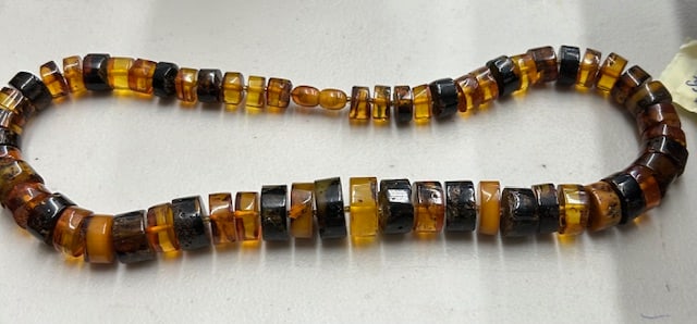 Baltic Amber Multicolored Disc Necklace: Item/Description: Chunky genuine Baltic Amber graduated bead choker. Honey, cider, and maple syrup hued button shaped slices of amber. Beautiful variations in shape color and inclusions. Hand-cut and