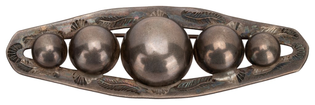 Sterling Southwestern Navajo Ball Brooch: Item/Description: Modernist Southwestern Navajo bar brooch with bubble ball design. Fred Harvey era Sterling Silver three dimensional bar pin. Modernist design. Tapered open oval shape. Set with ball 