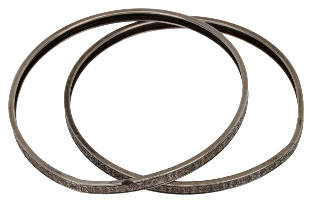 Walter Lampl Engraved Sterling Bangle Pair: Item/Description: Signed Art Deco era pair of engraved bangles by famed American jewelry designer, Walter Lampl (American, 1845-1945). Fashioned from Sterling Silver and engraved with a geometric flor