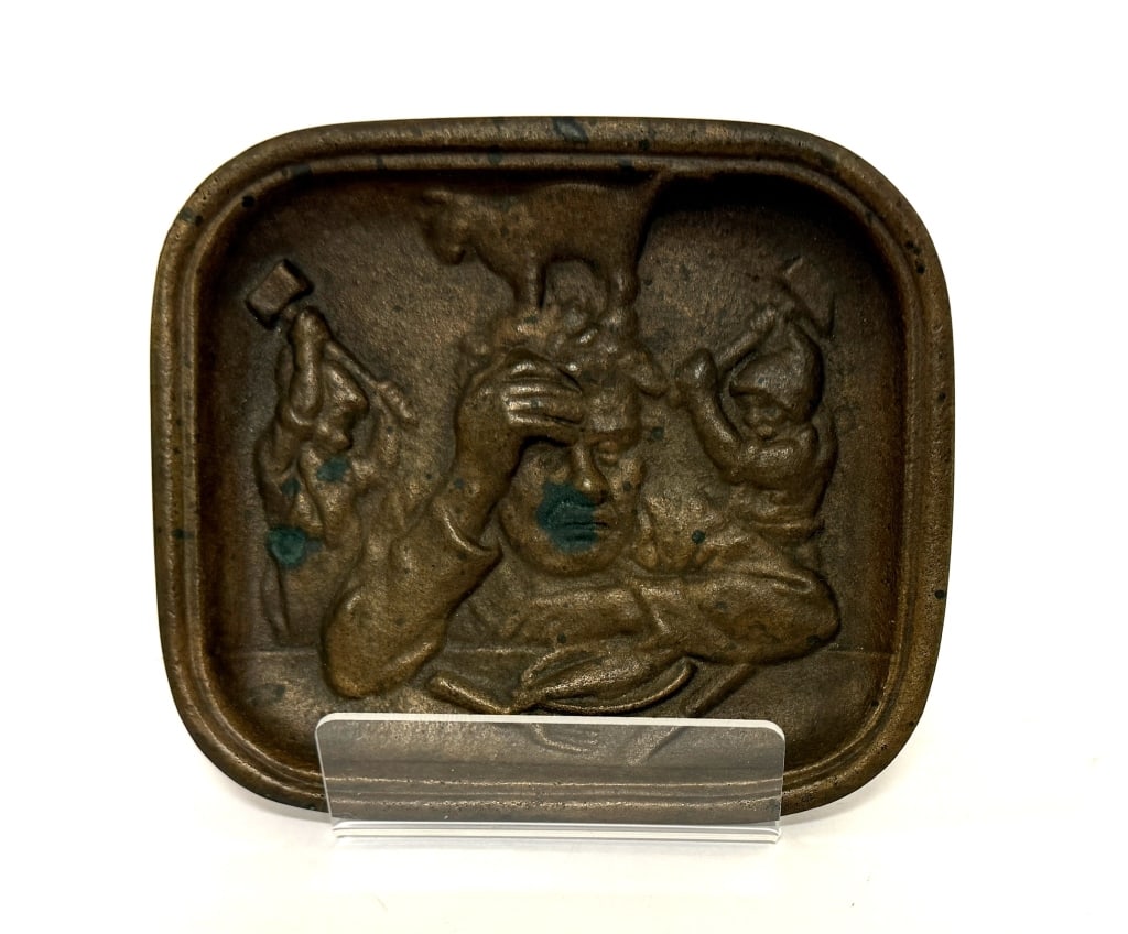 Swedish Bronze Relief Tray - The Hangover: Item/Description: Swedish bronze ashtray, "Baksmallan" or "The Hangover". Features a relief scene depicting a man holding his head in distress, small gnomes hitting him with hammers, a cat standing on