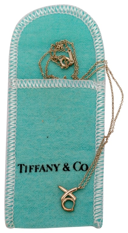 Tiffany Paloma Picasso Silver XO Pendant Necklace: Item/Description: Elegant designer Paloma Picasso for Tiffany & Company hugs and kisses XO pendant necklace. Beautifully crafted in Sterling Silver. Delicate rolo link chain. Stylized XO letters. Spri