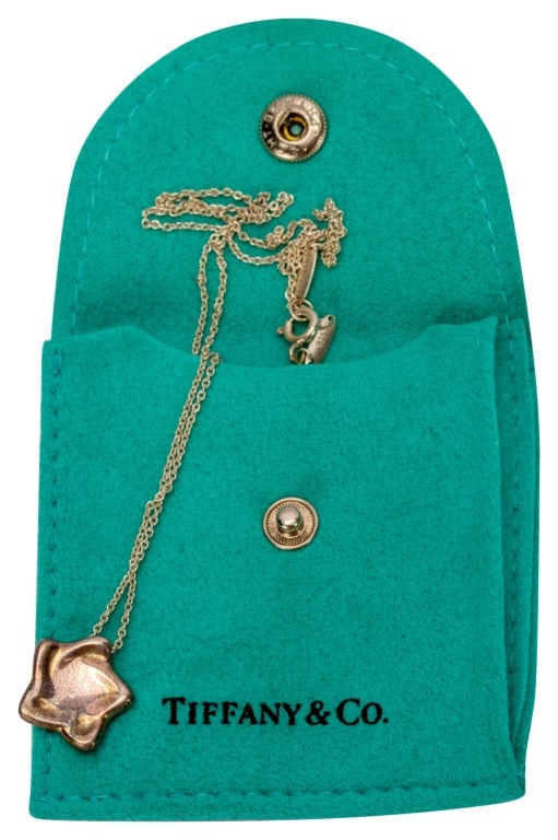 Tiffany Elsa Peretti Silver Star Pendant Necklace: Item/Description: Luxury design house, Tiffany & Co. figural star charm pendant necklace. Beautifully crafted in Sterling Silver by model-turned - jewelry designer, Elsa Peretti who joined Tiffany & C