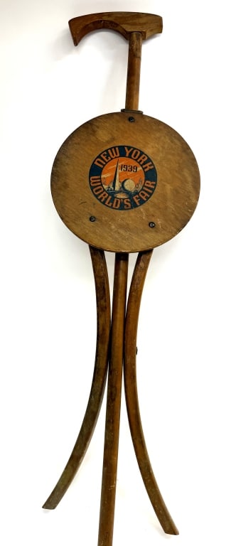 1939 NY World's Fair "Kan-O-Seat" Cane Seat: Item/Description: The 1939 New York World's Fair "Kan-O-Seat" cane seat is a vintage, collapsible walking stick, and stool souvenir manufactured by the Stafford-Johnson Seating Corporation in Ionia,
