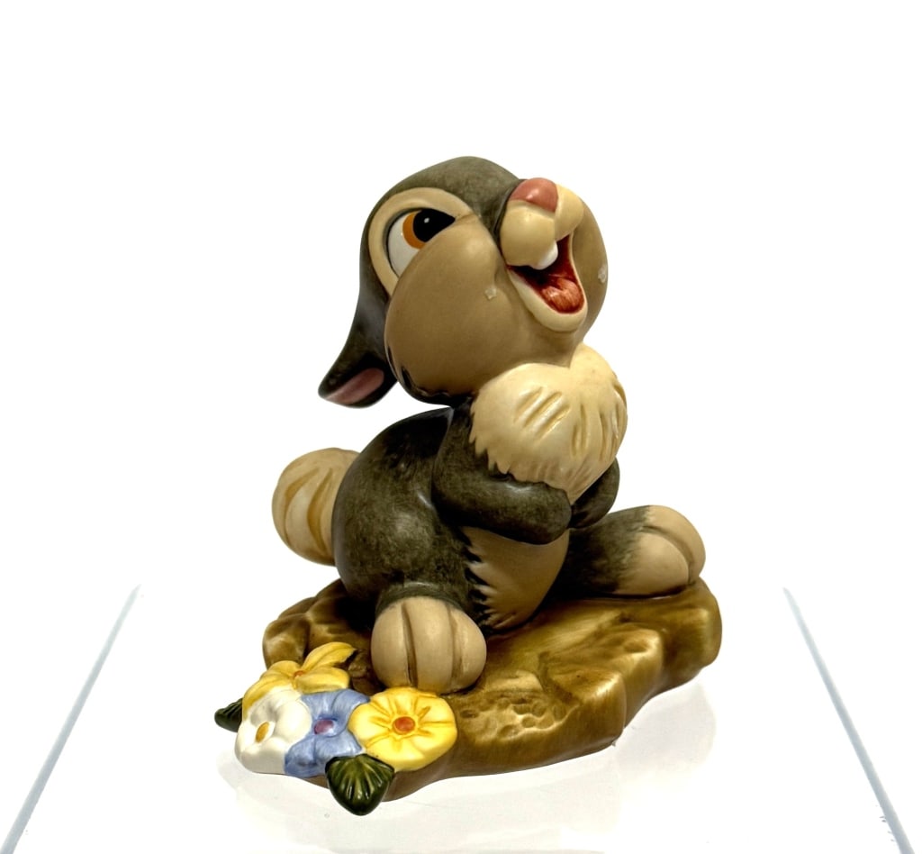 Classic Walt Disney Bambi Thumper Figurine: Item/Description: Walt Disney Classics Collection (WDCC) Thumper figurine titled "Hee! Hee! Hee!" from the 1942 Disney animated movie, Bambi. The figurine depicts Thumper in a sitting position, coveri