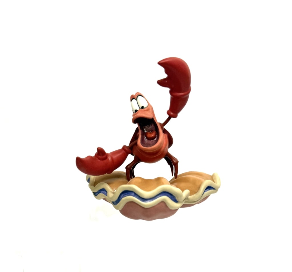 Disney Sebastian "The Little Mermaid" Figurine: Item/Description: Walt Disney Classics Collection (WDCC) figurine titled "Calypso Crustacean" featuring Sebastian from The Little Mermaid. The figurine depicts Sebastian with his mouth open and claws