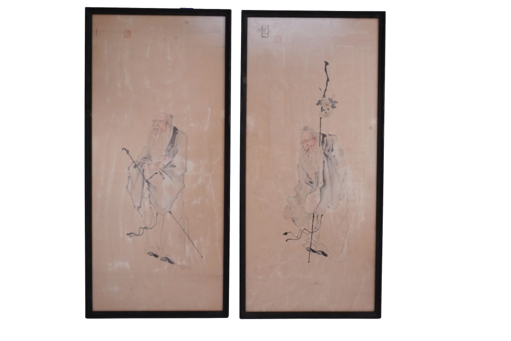 Pair of Chinese Scroll Paintings: Item/Description: Two framed ink wash watercolor paintings with red artist seal stamps. Both feature traditional elderly Confucian scholar figures with long white beards, each holding a staff. In matc