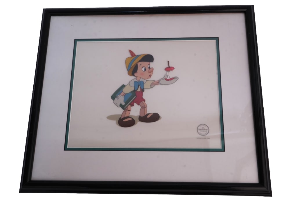 Disney "Here's Your Apple" Pinocchio Sericel: Item/Description: 1994 Walt Disney Studios limited edition sericel "Here?s Your Apple" from the film Pinocchio. LOA on back. Material: Celluloid, Wood Frame Dimensions: Image size: Height: 10 1/2"; Wi