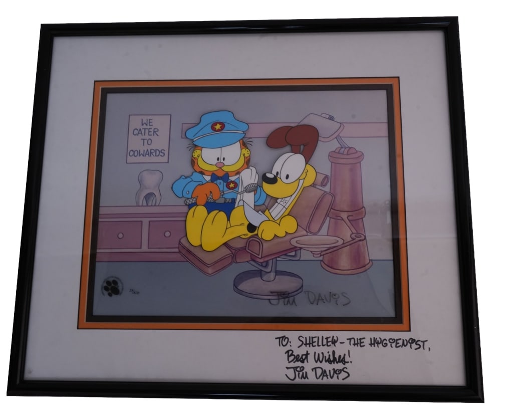Garfield "Smile Check Up" Signed Animation Cel: Item/Description: 1995 Jim Davis Garfield "Smile Check Up" hand-painted cartoon cel. Signed and inscribed to Shelley, the hygienist. Limited edition numbered #23/400. COA on back. Material: