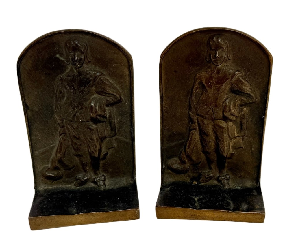 High Relief Bronze Bookends: Item/Description: Arched top, high relief bronze bookends featuring historical figures dressed in 18th-century European attire. Backings to both marked: Solid Bronze. Material: Bronze Dimensions: