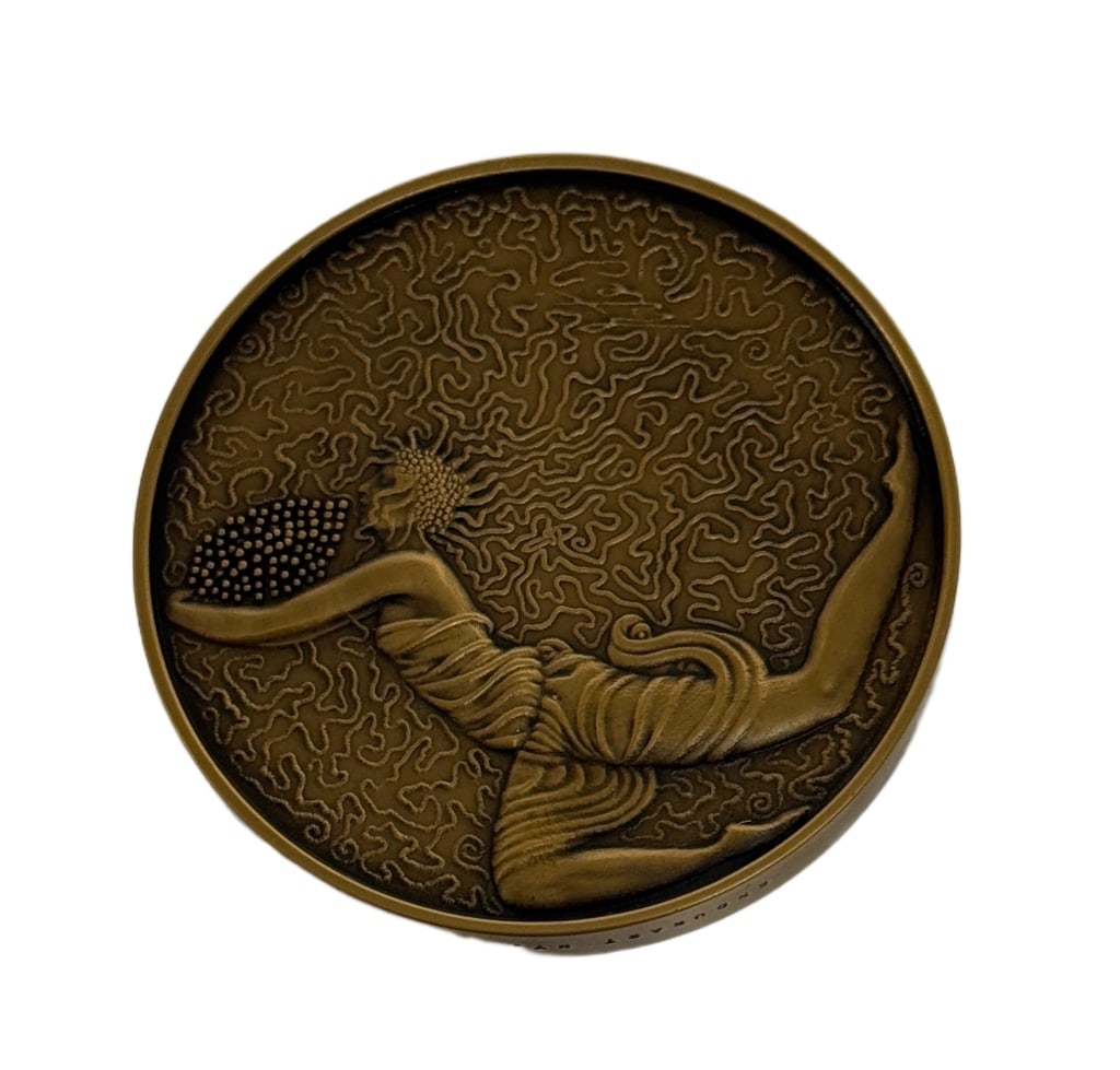 Erte Above & Below Bronze Medallion 66/1500: Item/Description: Erte Design Collection 'Above & Below' bronze medallion numbered 66/1500 by Russian-French artist Romain de Tirtoff (1892-1990). Marked 1988 Sevenarts, Endurant NY.Romain de