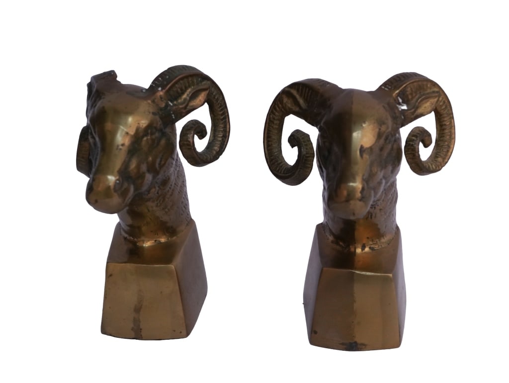 Andrea by Sadek Brass Rams Bookends Pair: Item/Description: Vintage Andrea by Sadek, Mid-Century Modern cast solid brass bookends modeled as ram's heads, dating to the 1960s-1970s. Each features a stylized ram with pronounced, tightly curled