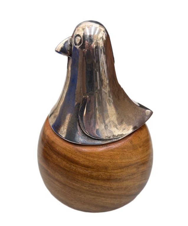 Danish Modern Lidded Round Bird Box: Item/Description: Polished wood and metal bird shaped lidded box. Danish, Mid-Century Modern aesthetic, featuring a metal top, shaped like a bird's head and wings, sitting on a rounded wooden base. Un