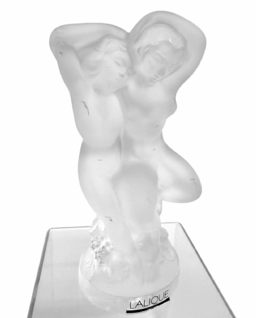 Lalique Le Faune Pan and Diana: Item/Description: Lalique France molded and frosted "Le Faune" crystal figure group. Designed by Marc Lalique in 1960. Glass sculpture features dancing nude mythological figures Pan and Diana. Lalique