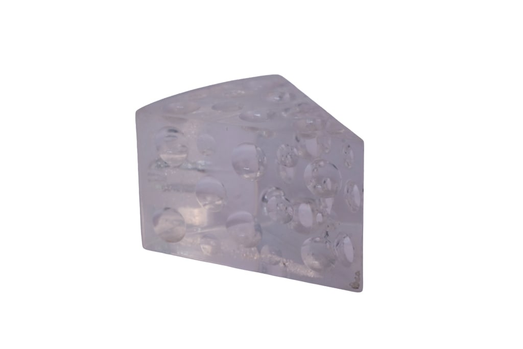 Mid-Century Modern "Swiss Cheese" Lucite Figurine: Item/Description: Vintage Mid-Century Modern lucite (acrylic) paperweight or desk sculpture in the form of a wedge of Swiss cheese, circa 1960s?1970s. Cast from a thick solid block of clear acrylic, t