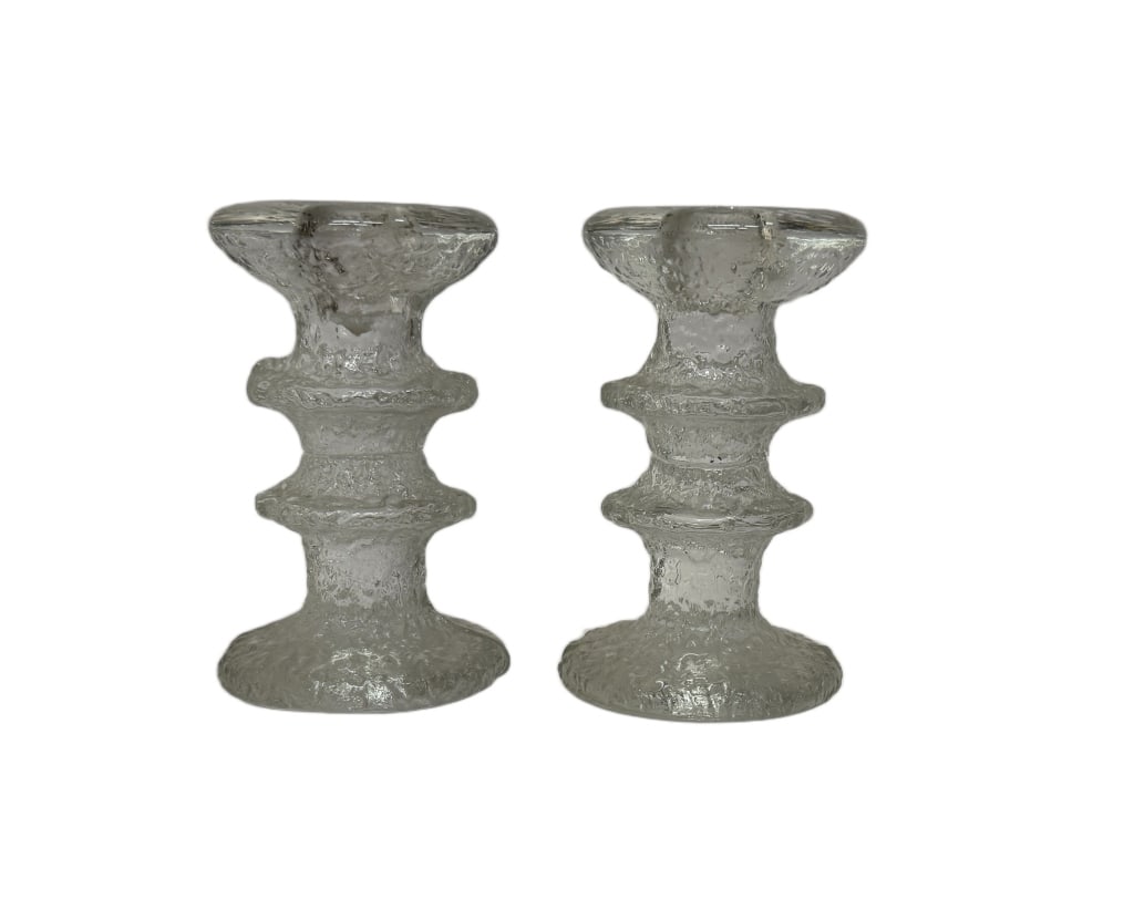 Iittala Festivo Timo Sarpaneva Glass Candlesticks: Item/Description: Designed in 1966 by Timo Sarpaneva (Finnish, 1926?2006), these iconic ice-textured Finnish glass candleholders feature a modular, "ringed" stem design originally inspired by the rugg