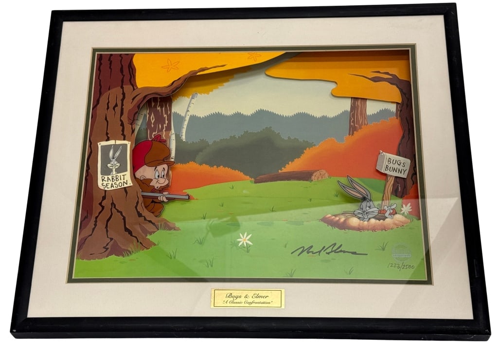 Mel Blanc Signed Animated 3D Mixed Media Display: Item/Description: Limited edition Animated Animation Bugs and Elmer "A Classic Confrontation" 3D display signed by original voice actor Mel Blanc. Model #WB1SS Material: Mixed Media, Wood Frame Dimens