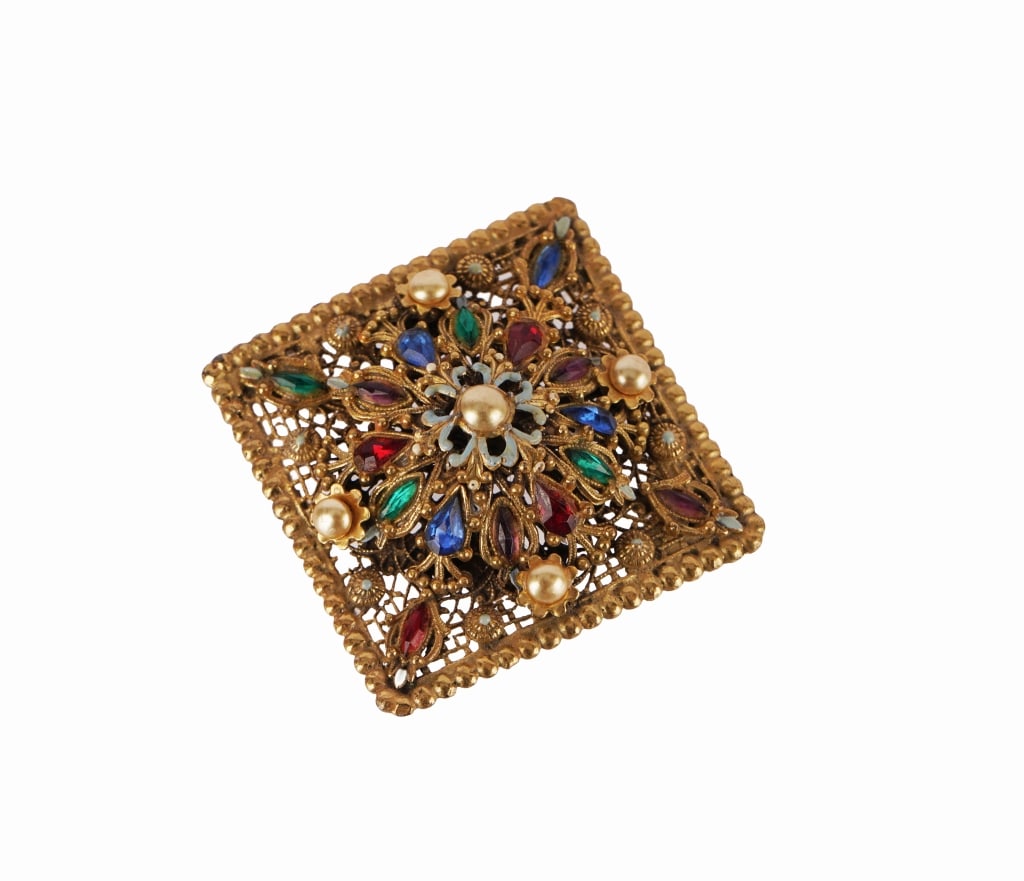 Alexander Korda Thief of Bagdad Jeweled Brooch: Item Description: Fabulous and beautifully designed 1940s era Etruscan style jeweled brooch designed for the movie "Thief of Bagdad". Ornate gold tone tone lacy domed mounting. Three dimensional.