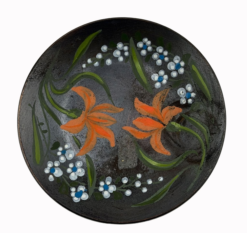 Chilean Decorative Copper Floral Bowl: Item/Description: A mid-20th-century Chilean decorative copper bowl featuring a hand-painted floral motif. The circular vessel displays two prominent orange lily-like blooms centered against a matte